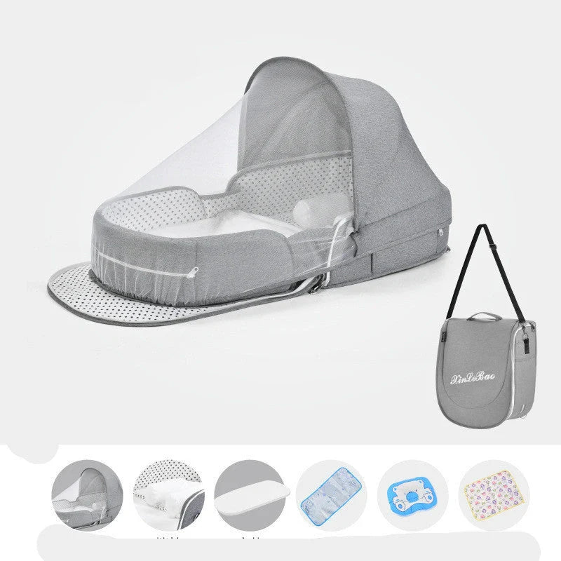 Portable baby crib with sun protection and mosquito net, foldable design for easy travel