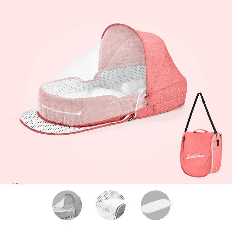 Portable baby crib with sun protection and mosquito net, foldable design for easy travel