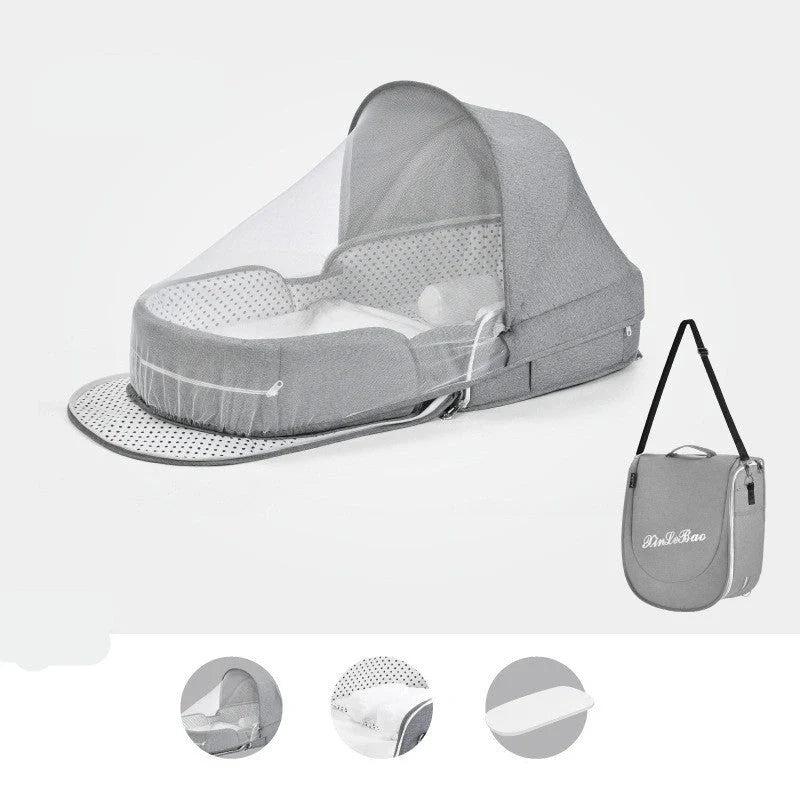 Portable baby crib with sun protection and mosquito net, foldable design for easy travel