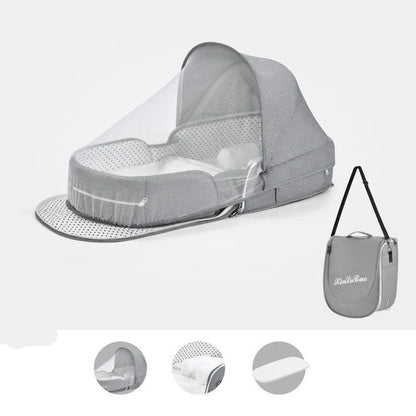 Portable baby crib with sun protection and mosquito net, foldable design for easy travel