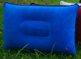 Rectangular PVC inflatable camping pillow showing dark blue colour with soft flocking texture and 38x24cm dimensions