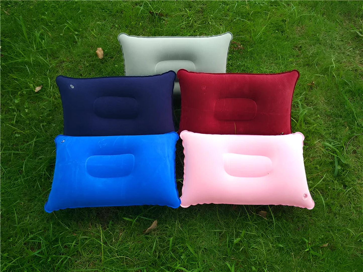 Rectangular PVC inflatable camping pillow showing dark blue colour with soft flocking texture and 38x24cm dimensions