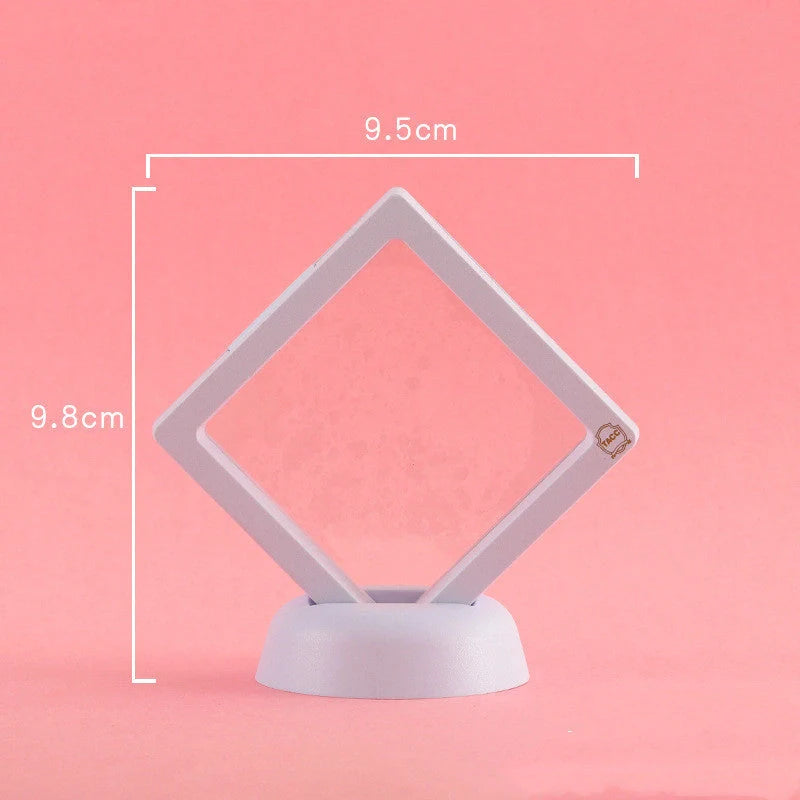 3D floating jewelry coin display stand in white and black, showcasing collectibles in mid-air