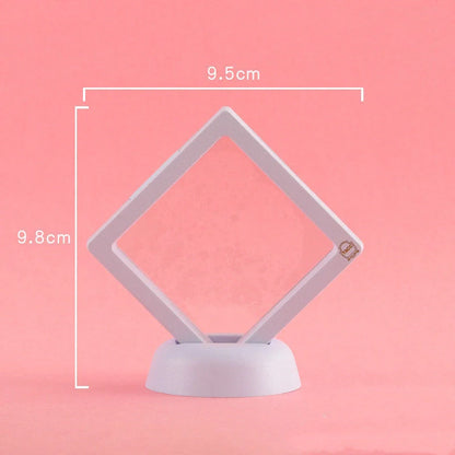 3D floating jewelry coin display stand in white and black, showcasing collectibles in mid-air