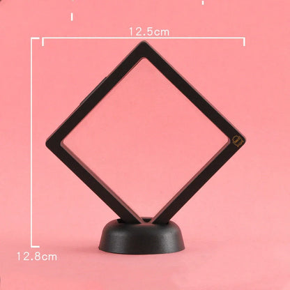 3D floating jewelry coin display stand in white and black, showcasing collectibles in mid-air