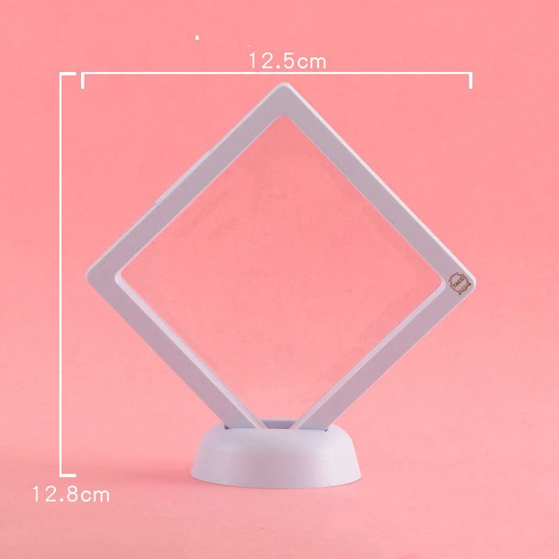 3D floating jewelry coin display stand in white and black, showcasing collectibles in mid-air