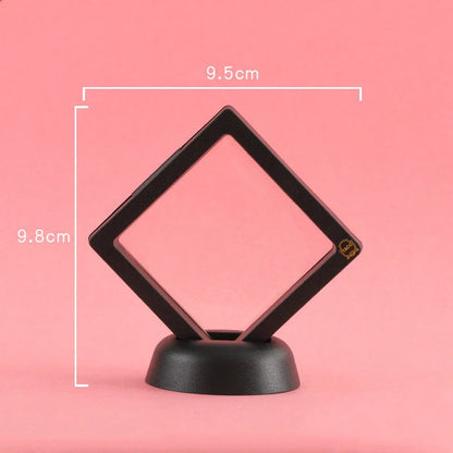 3D floating jewelry coin display stand in white and black, showcasing collectibles in mid-air