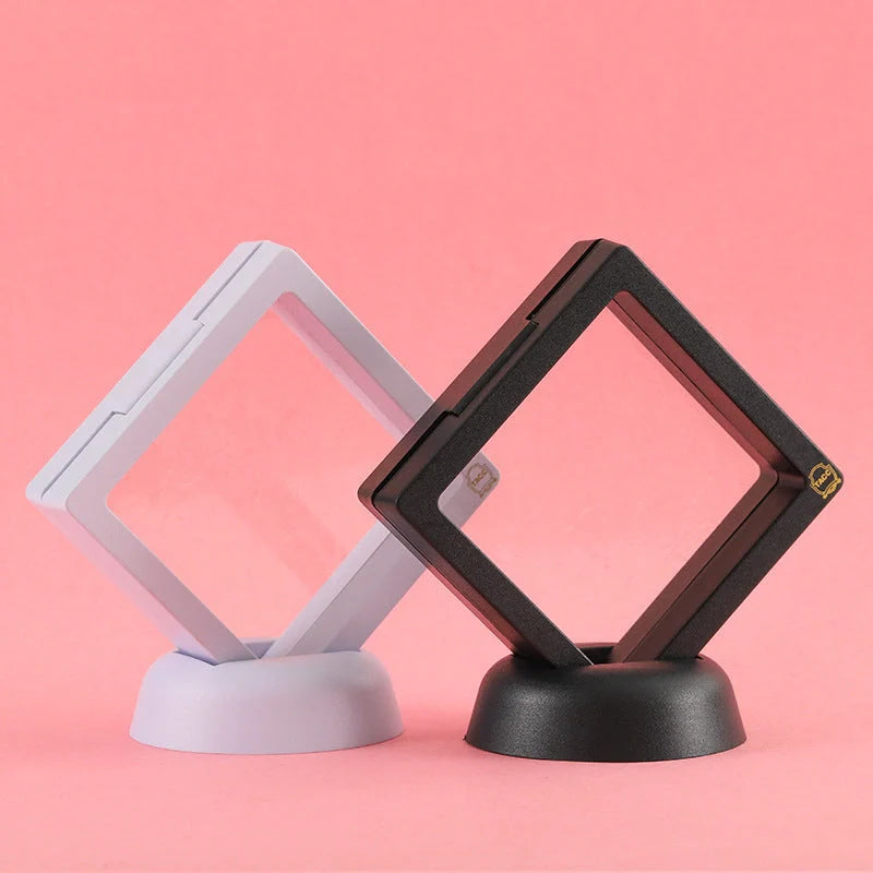 3D floating jewelry coin display stand in white and black, showcasing collectibles in mid-air