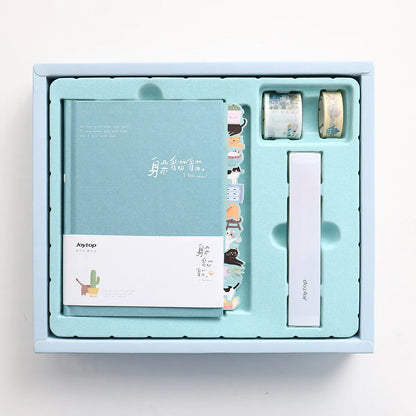 Peekaboo gift box hand ledger notebook with spiral binding, shown with an included pen.