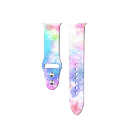 Apple Watch silicone band with colourful tie-dye pattern, shown attached to a watch and laid flat