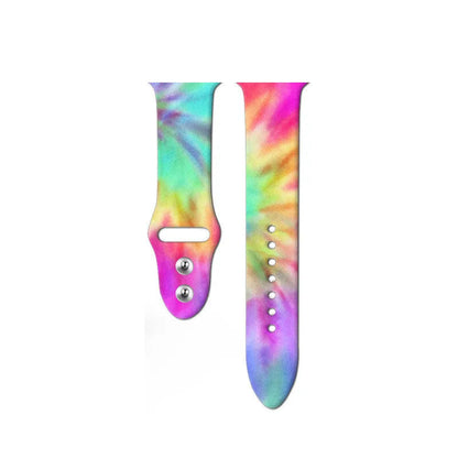 Apple Watch silicone band with colourful tie-dye pattern, shown attached to a watch and laid flat