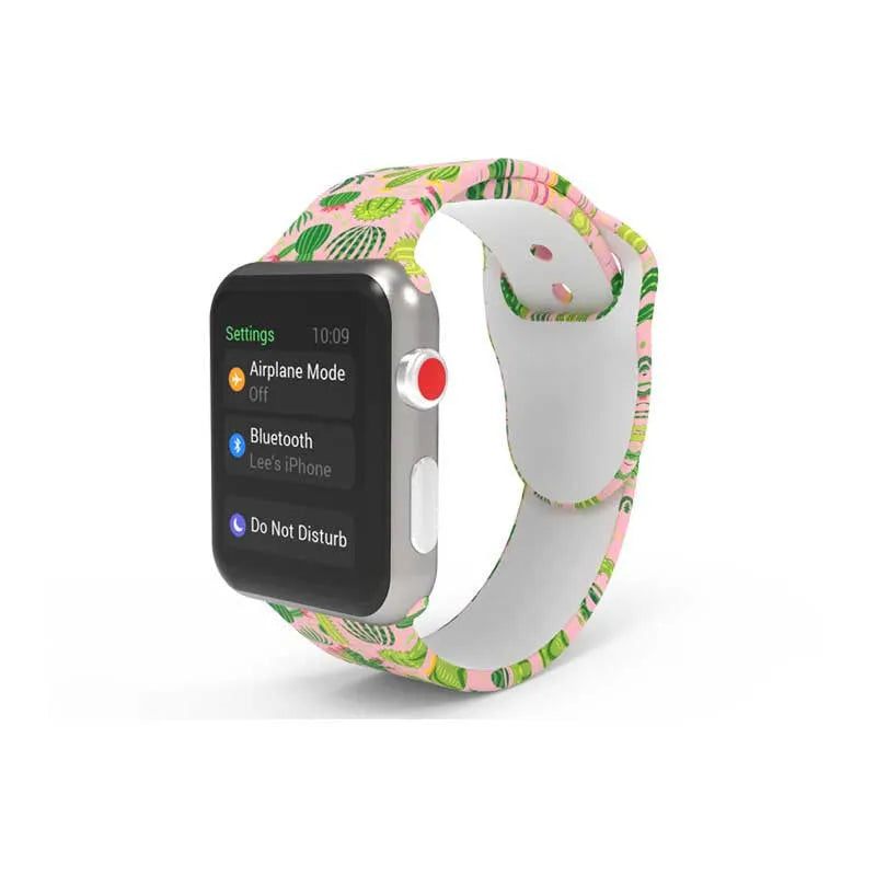 Apple Watch silicone band with colourful tie-dye pattern, shown attached to a watch and laid flat