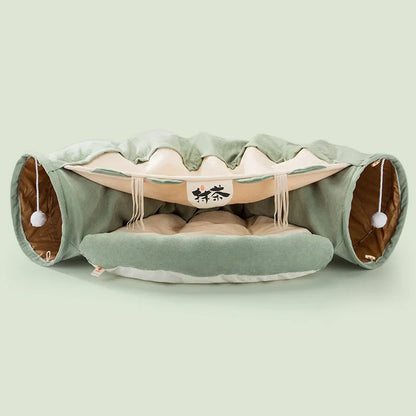 Collapsible cloth cat tunnel in pink colour, shown in both open and folded positions.