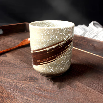 Japanese ceramic tea cup with kiln-fired pigmented glaze and external thread design