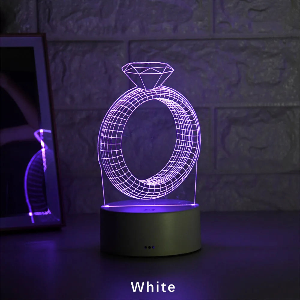 3D LED night light showing diamond ring stereogram with colour-changing illumination on acrylic surface