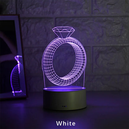 3D LED night light showing diamond ring stereogram with colour-changing illumination on acrylic surface
