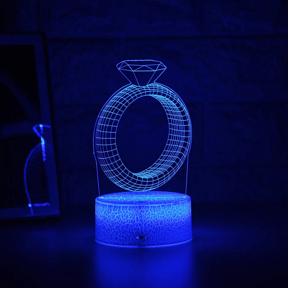 3D LED night light showing diamond ring stereogram with colour-changing illumination on acrylic surface