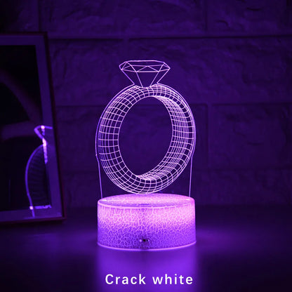 3D LED night light showing diamond ring stereogram with colour-changing illumination on acrylic surface