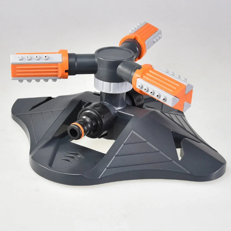 Adjustable 360-degree 3-arm rotating sprinkler in green and orange for efficient lawn irrigation
