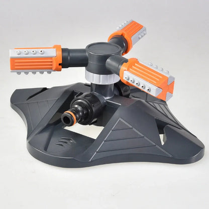 Adjustable 360-degree 3-arm rotating sprinkler in green and orange for efficient lawn irrigation
