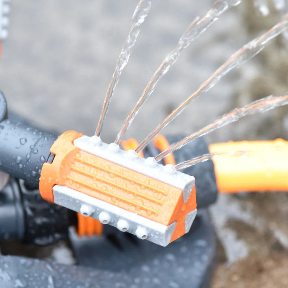 Adjustable 360-degree 3-arm rotating sprinkler in green and orange for efficient lawn irrigation