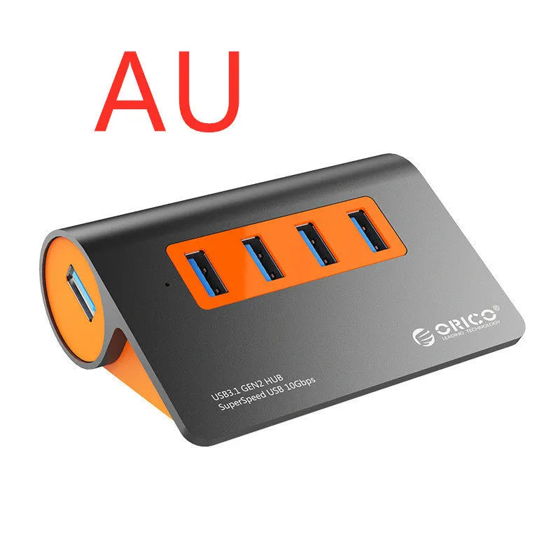 Dark grey and orange aluminium laptop hub with four USB ports, a blue LED light, and a detached cable.