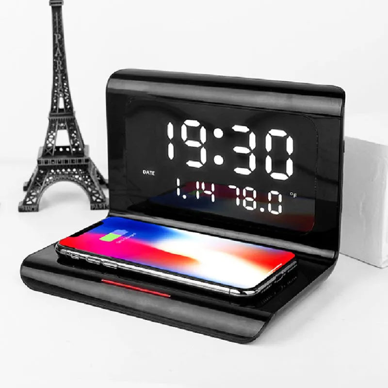 White wireless charger alarm clock showing time, date, temperature display with phone charging