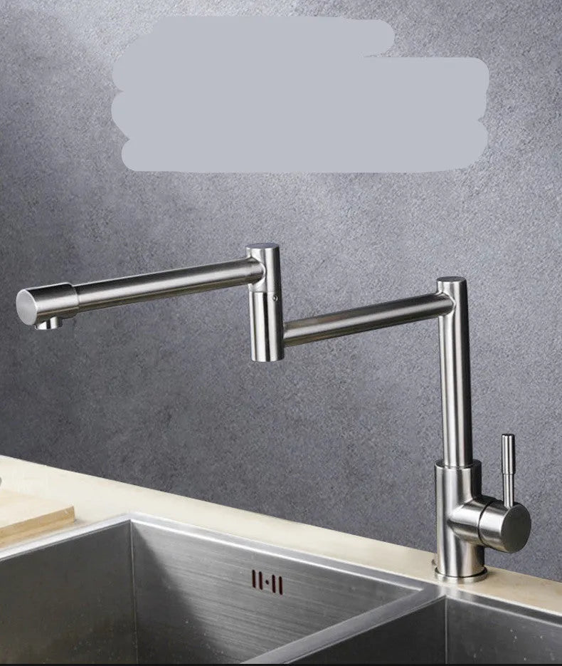 Silver stainless steel kitchen mixer tap with two lever handles and a spout rotated to the side.
