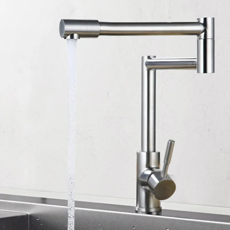 Silver stainless steel kitchen mixer tap with two lever handles and a spout rotated to the side.