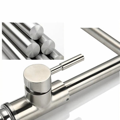Silver stainless steel kitchen mixer tap with two lever handles and a spout rotated to the side.