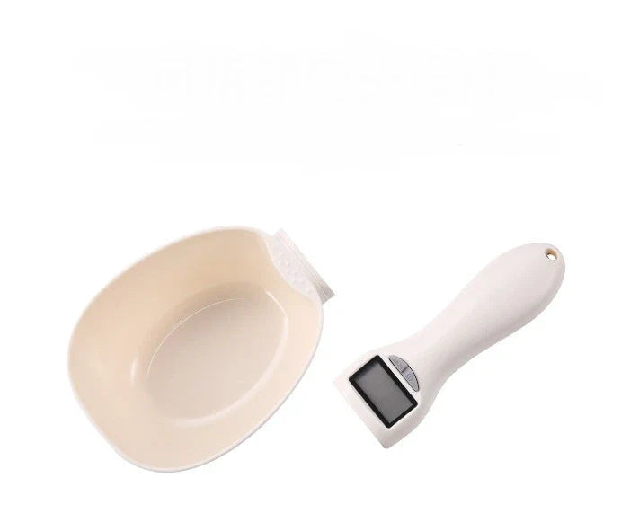 Compact digital kitchen scale with sleek beige design, showing four measurement units and detachable spoon for convenient use in home baking and cooking.