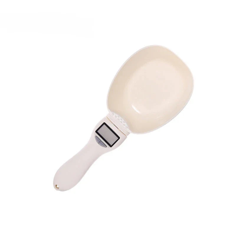 Compact digital kitchen scale with sleek beige design, showing four measurement units and detachable spoon for convenient use in home baking and cooking.