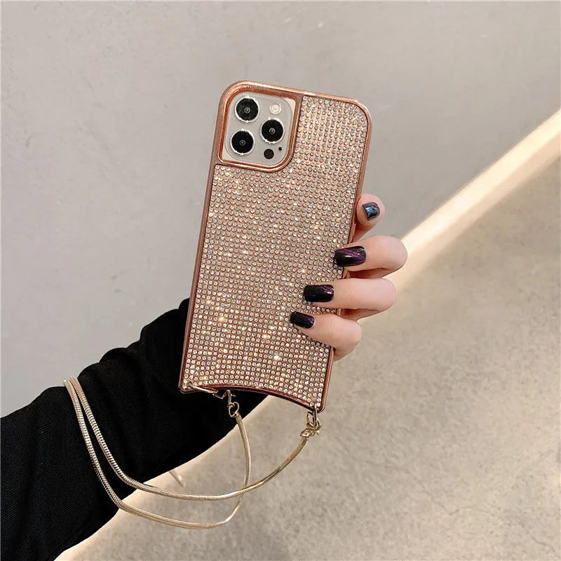 Glitter rhinestone TPU iPhone case with necklace lanyard strap in black, shown on an iPhone 12.