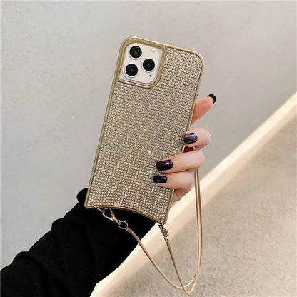 Glitter rhinestone TPU iPhone case with necklace lanyard strap in black, shown on an iPhone 12.