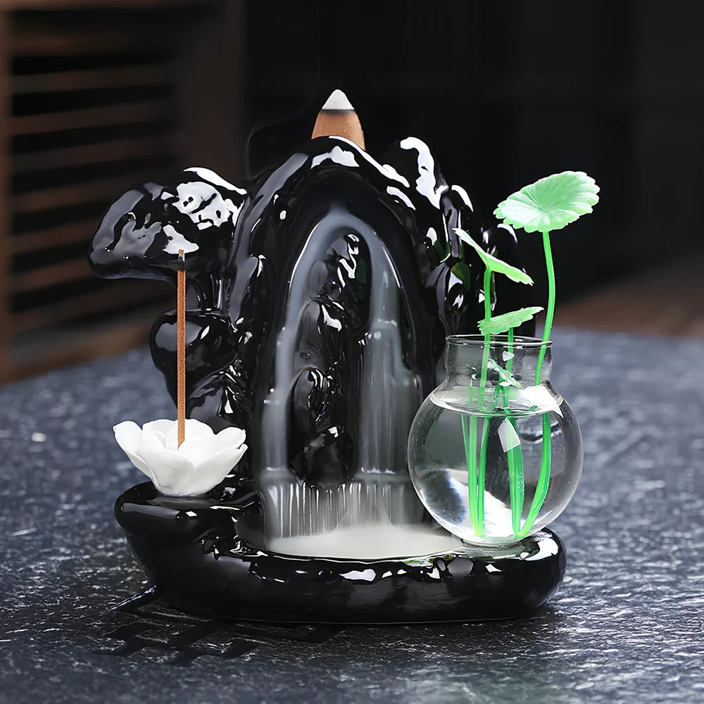 Black ceramic backflow incense burner creating waterfall smoke with sandalwood aroma