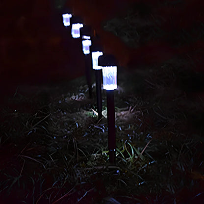 Solar lawn light with LED illumination in garden setting, measuring 55mm by 55mm by 350mm