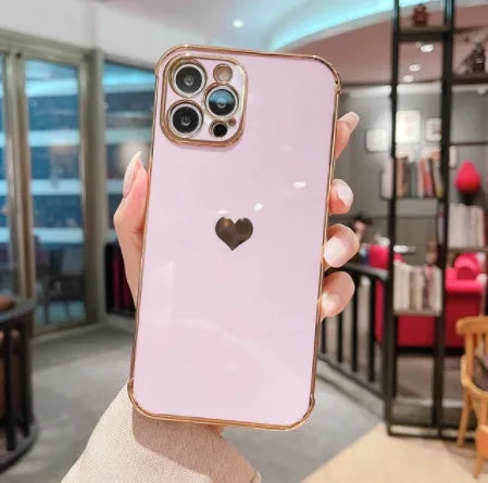 White iPhone case with a silver electroplated love design on the back, showing its flexible TPU anti-fall construction.