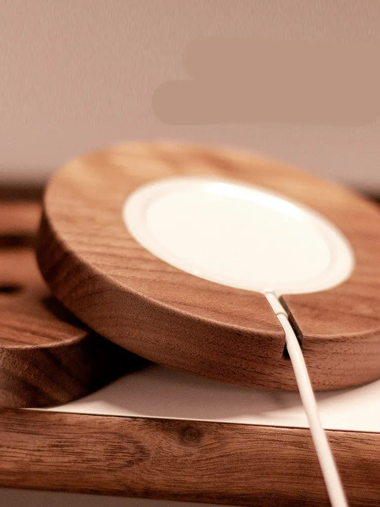 Walnut wood magnetic wireless charging stand with square bracket on desktop