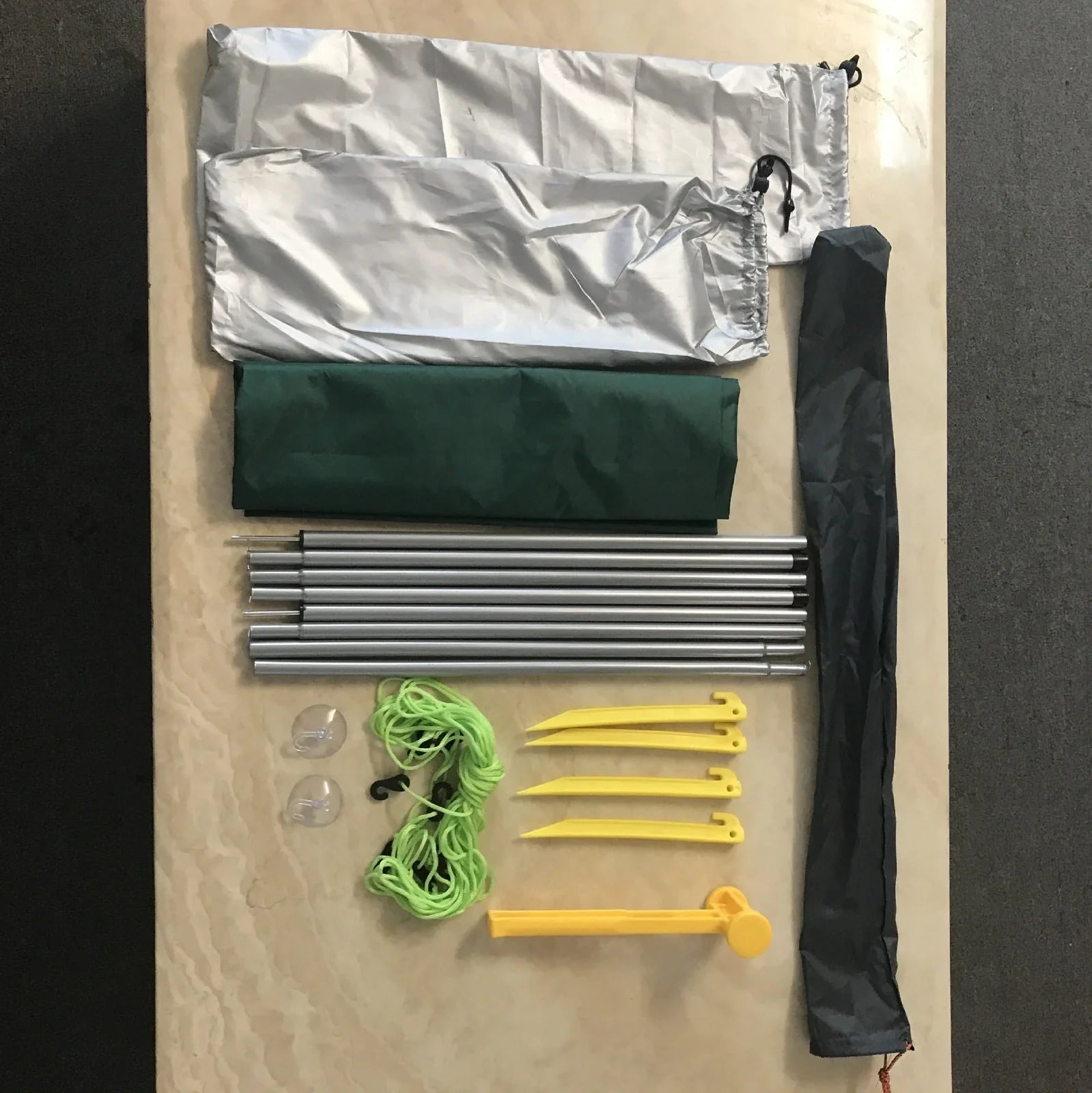 Green double tent awning with aluminium poles measuring 2.8m long by 1.8m wide