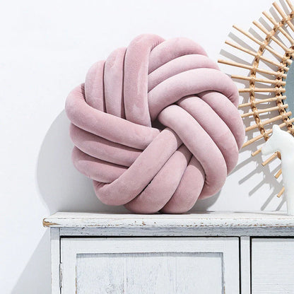 Plush decorative throw pillows with knotted ball design in various colors for living room, bedroom, and photography