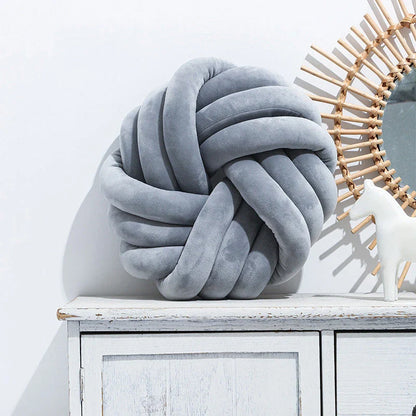 Plush decorative throw pillows with knotted ball design in various colors for living room, bedroom, and photography