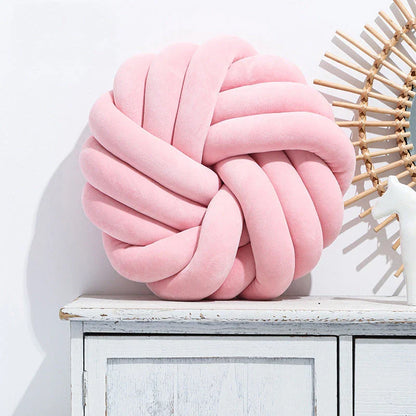 Plush decorative throw pillows with knotted ball design in various colors for living room, bedroom, and photography