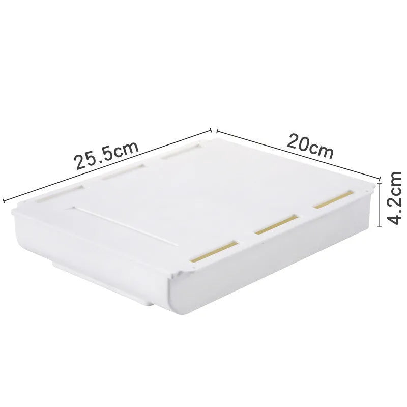 Japanese style plastic drawer storage box in grey and white colours placed under a table