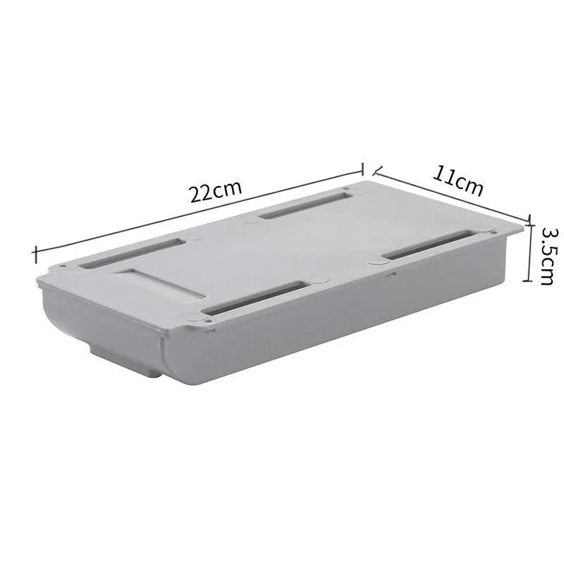 Japanese style plastic drawer storage box in grey and white colours placed under a table
