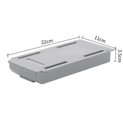 Japanese style plastic drawer storage box in grey and white colours placed under a table
