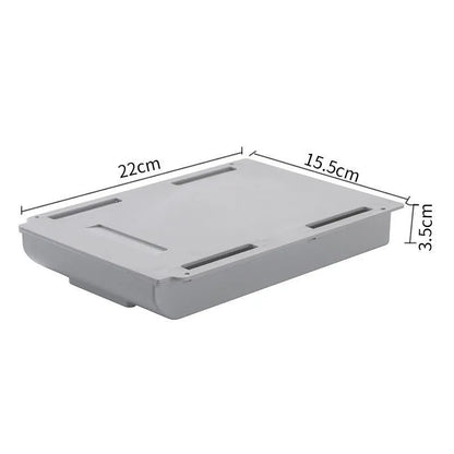 Japanese style plastic drawer storage box in grey and white colours placed under a table