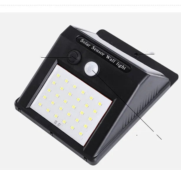Solar-powered outdoor garden lamp with motion sensor mounted on wooden post