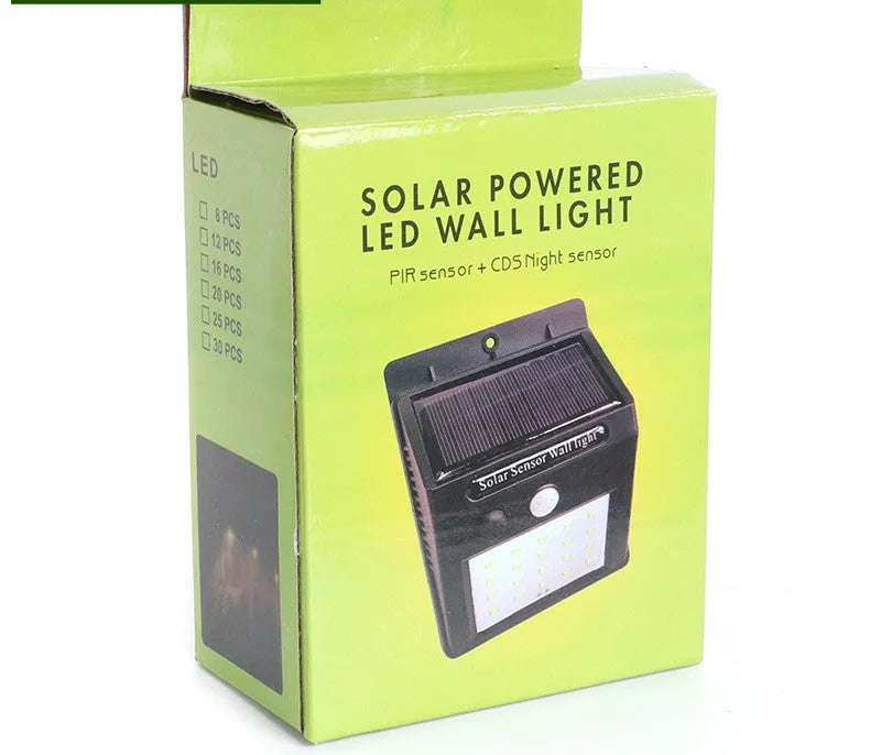 Solar-powered outdoor garden lamp with motion sensor mounted on wooden post