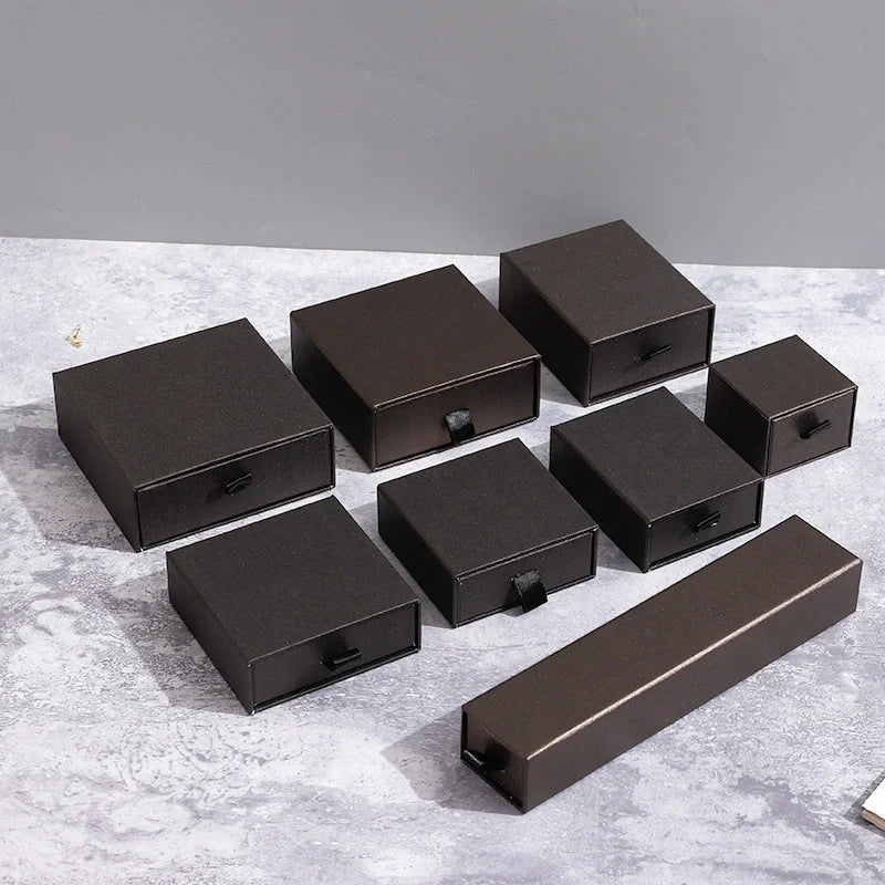 Drawer-style jewellery storage box with pull-out trays for organised accessory storage