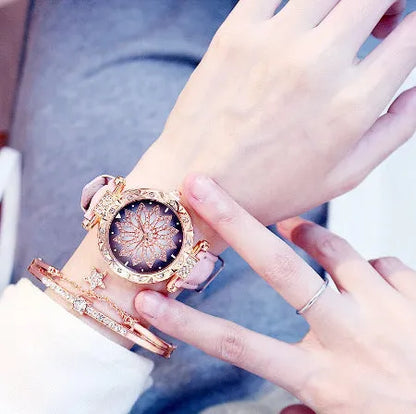 Women's diamond decorative watch with round dial showing red colour option and pin buckle clasp